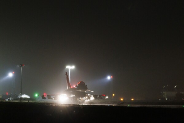 In this image provided by the UK Ministry of Defence, a Royal Air Force Typhoon FGR4 takes off to carry out air strikes against Houthi military targets in Yemen, from RAF Akrotiri, Cyprus, Monday, Jan. 22, 2024. The U.S. and British militaries bombed eight locations used by the Iranian-backed Houthis in Yemen on Monday night, the second time the two allies have conducted coordinated retaliatory strikes on an array of the rebels' missile-launching capabilities. (AS1 Jake Green RAF/Ministry of Defence via AP)