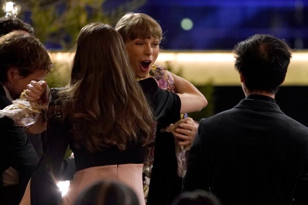 Taylor Swift reacts as she3 is announced as winner of the award for album of the year for "Folklore" at the 63rd annual Grammy Awards at the Los Angeles Convention Center on Sunday, March 14, 2021. (AP Photo/Chris Pizzello)