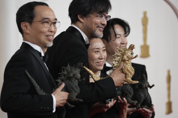 Masaki Takahashi, from left, Takashi Yamazaki, Kiyoko Shibuya and Tatsuji Nojima arrive at the Oscars on Sunday, March 10, 2024, at the Dolby Theatre in Los Angeles. (AP Photo/Ashley Landis)