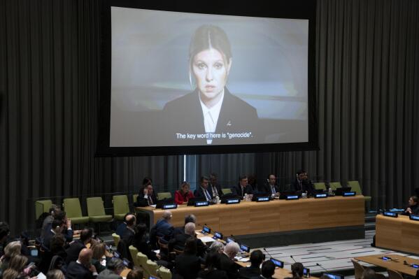 First Lady of Ukraine Olena Zelenska addresses attendees via video during a meeting on the "Gross Human Rights Violations Due To The Aggression Against Ukraine" in the Trusteeship Council Chamber, Wednesday, Feb. 22, 2023, at United Nations headquarters. (AP Photo/John Minchillo)