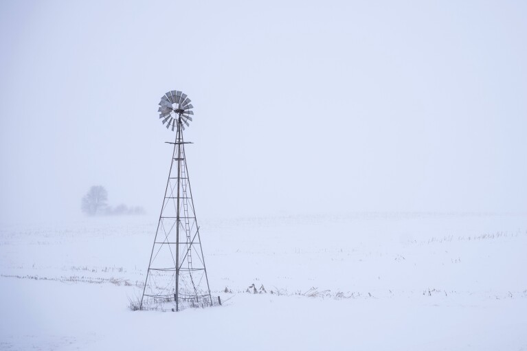 FILE - A wind turbine is seen near Merrill, Iowa on Jan. 12, 2024.  Arctic-like temperatures, raising concerns about voting for the Iowa caucuses on Monday, January 15, have focused attention on the presidential nominating system.  It has long been criticized as antiquated and undemocratic.  (AP Photo/Carolyn Castor, File)