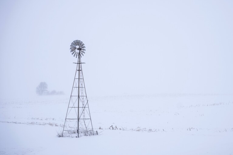 FILE - A windmill is seen near Merrill, Iowa on January 12, 2024.  Arctic-like temperatures, raising concerns about voting for the Iowa caucuses on Monday, Jan. 15, are putting a spotlight on the presidential nominating system.  For a long time it has been criticized as conservative and undemocratic.  (AP Photo/Caroline Castor, File)