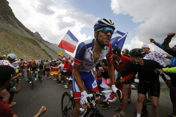 France's Thibaut Pinot climbs the Galibier pass during the eighteenth stage of the Tour de France cycling race over 208 kilometers (130 miles) with start in Embrun and finish in Valloire, France, Thursday, July 25, 2019. (AP Photo/ Christophe Ena)