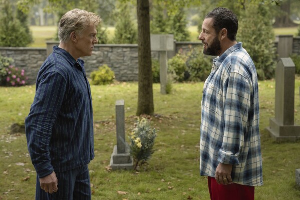 This image released by Netflix shows Christopher McDonald, left, and Adam Sandler in a scene from "Happy Gilmore 2." (Scott Yamano/Netflix via AP)