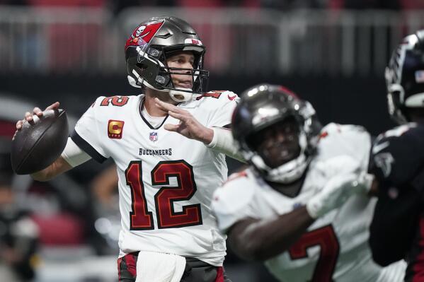 Tampa Bay Buccaneers quarterback Tom Brady (12) works in the pocket against the Atlanta Falcons during the first half of an NFL football game, Sunday, Dec. 5, 2021, in Atlanta. (AP Photo/Brynn Anderson)