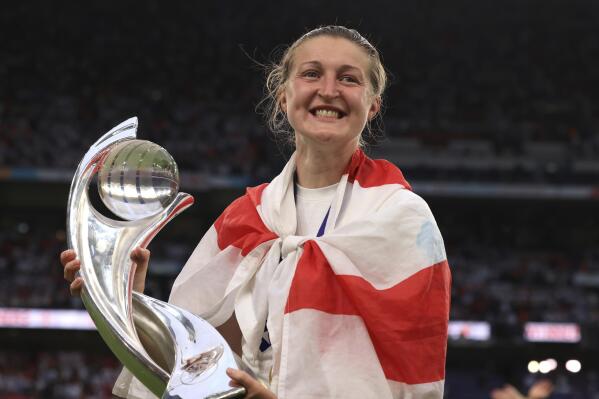 FILE - England's Ellen White poses with the trophy yhe Women's Euro 2022 final soccer match between England and Germany at Wembley stadium in London, Sunday, July 31, 2022. White announced her retirement from soccer Monday, Aug. 22, 2022, after saying her “dreams came true” when the Lionesses won the Women's European Championship last month. (AP Photo/Leila Coker, File)