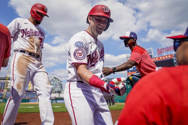 Los Angeles, United States. 27th July, 2022. Washington Nationals Luis  Garcia (2) is greeted by teammate Lane Thomas (L) after hitting a solo home  run to right off Los Angeles Dodgers reliever