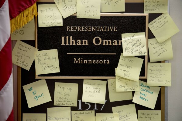
              People leave post-it notes of support outside the office of Rep. Ilhan Omar, D-Minn., on Capitol Hill, Monday, Feb. 11, 2019, in Washington. Omar has "unequivocally" apologized for tweets suggesting a powerful pro-Israel interest group paid members of Congress to support Israel. Earlier Monday, House Speaker Nancy Pelosi and other Democrats had rebuked her for the tweets. (AP Photo/Andrew Harnik)
            