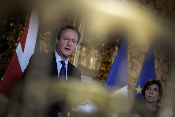 French Foreign Minister Catherine Colonna, right, and Britain's Foreign Secretary David Cameron address the media during a press conference in Paris, Tuesday, Dec. 19, 2023. Britain and France are reiterating their determination that Russia's invasion of Ukraine must end in failure. (AP Photo/Christophe Ena)