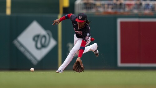 Washington Nationals shortstop CJ Abrams catches a ground ball during the fourth inning of a baseball game against the Texas Rangers, Sunday, July 9, 2023, in Washington. (AP Photo/Stephanie Scarbrough)