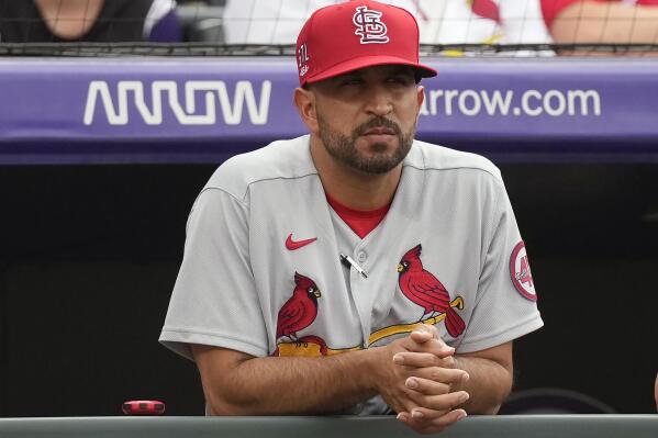 FILE - St. Louis Cardinals bench coach Oliver Marmol watches from the dugout in the first inning of the team's baseball game against the Colorado Rockies in Denver, in this Friday, July 2, 2021, file photo. The Cardinals plan to announce Monday, Oct. 25, 2021, that bench coach Oliver Marmol will be promoted to replace fired manager Mike Shildt, according to a person familiar with the decision. The person spoke to The Associated Press on condition of anonymity Sunday night because the team hadn't revealed the hiring publicy. (AP Photo/David Zalubowski, File)