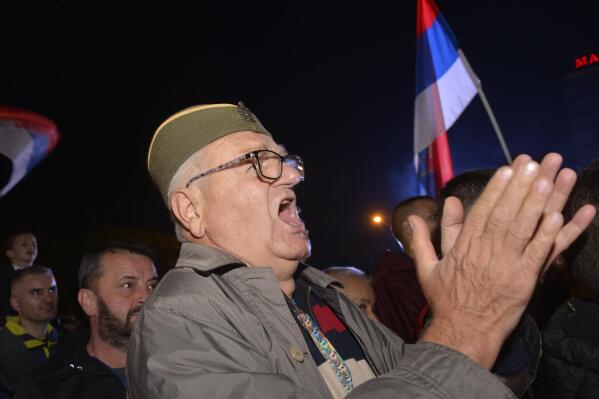 A man wearing a traditional Serbian hat shout slogans during a protest against alleged election fraud in the general elections in the Bosnian town of Banja Luka, 240 kms northwest of Sarajevo, Sunday, Oct. 9, 2022. Thousands on Sunday rallied in Bosnia for the second time in a week, alleging that pro-Russian Bosnian Serb leader Milorad Dodik rigged a ballot during a general election in the Balkan country last weekend. (AP Photo/Radivoje Pavicic)