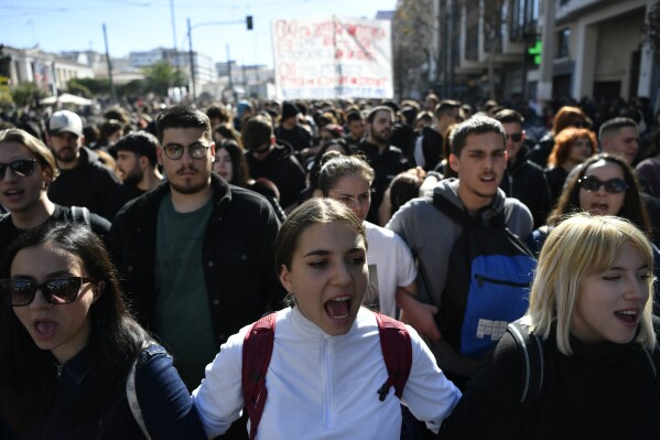 Students shout slogans during a rally against plans by Greece's conservative government to legalize privately-run universities, in Athens, Thursday, Feb. 8, 2024. More than 15,000 protesters have gathered in central Athens in opposition to plans by the conservative government to establish private universities, starting next year. (AP Photo/Michael Varaklas)