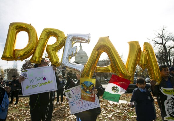 In this Dec. 6, 2017, file photo, demonstrators hold up balloons during an immigration rally in support of the Deferred Action for Childhood Arrivals (DACA), and Temporary Protected Status (TPS), programs, near the U.S. Capitol in Washington.  (AP Photo/Jose Luis Magana, File)