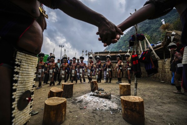 Indigenous Nagas dance during the Hornbill Festival in Kisama, on the outskirts of Kohima, capital of the northeastern Indian state of Nagaland, Tuesday, Dec. 10, 2024. (AP Photo/Anupam Nath)