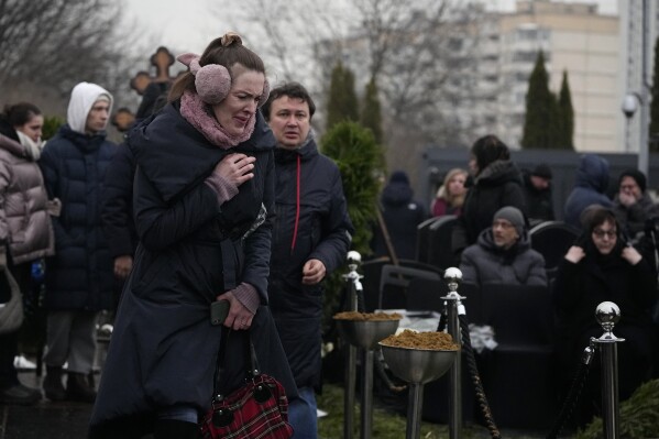 People react during the funeral ceremony for Russian opposition leader Alexei Navalny at the Borisovskoye Cemetery during the funeral ceremony, in Moscow, Russia, Friday, March 1, 2024. Under a heavy police presence, thousands of people bade farewell Friday to Alexei Navalny at his funeral in Moscow after his still-unexplained death two weeks ago in an Arctic penal colony. (AP Photo)