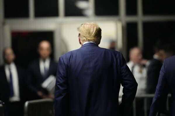 Former President Donald Trump heads to the courtroom after speaking at Manhattan criminal court, Tuesday, April 16, 2024, in New York. Donald Trump returned to the courtroom Tuesday as a judge works to find a panel of jurors who will decide whether the former president is guilty of criminal charges alleging he falsified business records to cover up a sex scandal during the 2016 campaign. (AP Photo/Mary Altaffer, Pool)