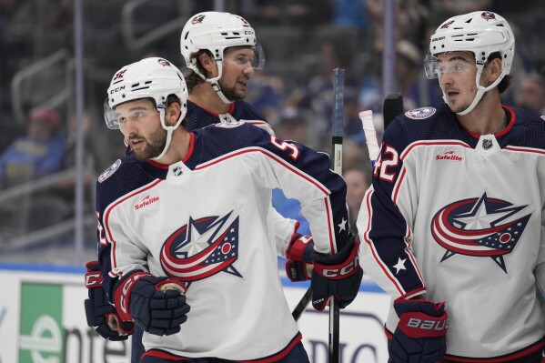 Columbus Blue Jackets' Emil Bemstrom, left, celebrates after scoring as teammate Alexandre Texier (42) watches during the first period of a preseason NHL hockey game against the St. Louis Blues Tuesday, Sept. 26, 2023, in St. Louis. (AP Photo/Jeff Roberson)