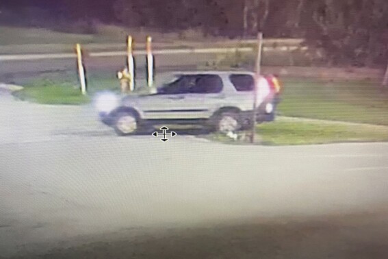 This image provided by Michigan State Police shows a vehicle driven by a person suspected of setting fire and shooting at multiple Michigan State Police patrol vehicles in the sate's Upper Peninsula. The vehicles at the Sault Ste. Marie Post were lit on fire and struck by rifle rounds early Wednesday, Sept. 6, 2023, state police said. No troopers were in the vehicles at the time of the attack. (Michigan State Police via AP)