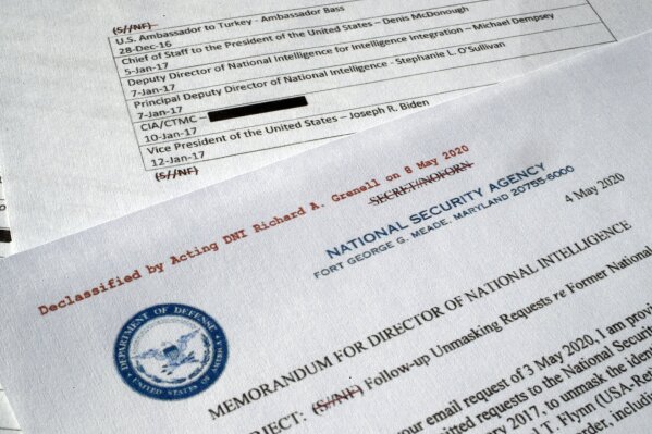 A declassified document with names of President Barack Obama administration officials who made requests for unmasking of Michael Flynn's name is photographed Wednesday, May 13, 2020. In 2016, Obama administration officials received intelligence reports that were concerning, but incomplete. Surveillance of Russia’s ambassador to the U.S. revealed he had interacted with an unnamed American who may have been undercutting efforts to pressure Vladimir Putin’s government. Using a common process known as “unmasking,” they asked intelligence agencies to reveal the American’s name. It was Flynn, an adviser to President-elect Donald Trump. The document was declassified by acting Director of National Intelligence Richard Grenell. (AP Photo/Jon Elswick)
