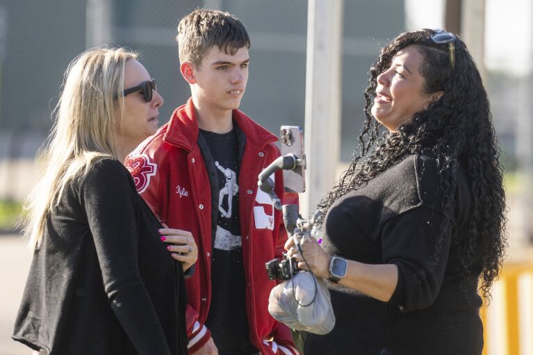 People react after a press conference where law enforcement officials announced that 11-year-old Audrii Cunningham was found dead in the Trinity River near her home in Livingston, Texas., Tuesday, Feb. 20, 2024, in Livingston. (Jason Fochtman/Houston Chronicle via AP)