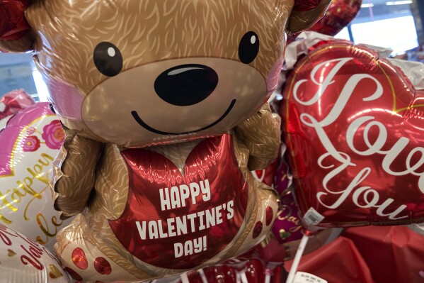 FILE - Valentine's Day balloons are displayed at a grocery store in Buffalo Grove, Ill., Feb. 10, 2022. In 2024, Feb. 14 is a holiday heavyweight due to a calendar collision of events — it’s Valentine’s Day and Ash Wednesday. (AP Photo/Nam Y. Huh, File)