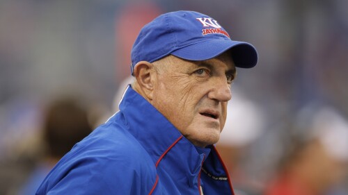 FILE - Kansas athletic director Lew Perkins watches during the second half of the team's NCAA college football game against Oklahoma on Oct. 24, 2009, in Lawrence, Kan. Longtime college administrator Perkins, who played basketball at Iowa before serving as the athletic director at several universities and taking on an influential role within the NCAA, died Tuesday, July 18, 2023. He was 78. Perkins’ family announced his death in a statement issued by Kansas. (AP Photo/Orlin Wagner, File)