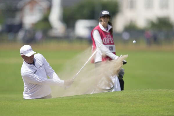 United States Stewart Cink plays out of a bunker on the 18th green on the first day of the British Open Golf Championships at the Royal Liverpool Golf Club in Hoylake, England, Thursday, July 20, 2023. (AP Photo/Kin Cheung)