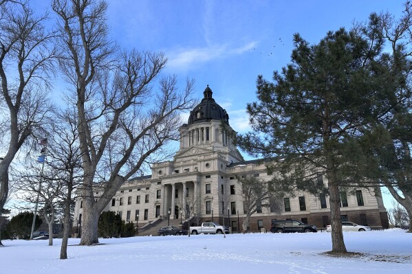 FILE - The South Dakota Capitol stands in Pierre, S.D., Jan. 10, 2024. The Republican-controlled South Dakota Senate, on Monday, Feb. 5, 2024, rejected a proposed 2024 ballot measure to lower the state's food tax to zero and to repeal a temporary sales tax cut passed the year before. (AP Photo/Jack Dura, File)
