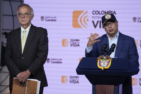 Colombia's President Gustavo Petro speaks during a press conference flanked by Colombia's Defense Minister Ivan Velasquez at the Narino Presidential Palace in Bogota, Colombia, Tuesday, April 30, 2024. Petro said thousands of grenades and bullets have gone missing from army bases. (AP Photo/Fernando Vergara)