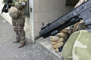 French soldiers of France's anti-terror 'Vigipirate' plan, dubbed 'Operation Sentinelle' patrol in Paris, Sunday, March 3, 2024. French authorities are searching for an assailant who attacked a man near a synagogue in Paris, Interior Minister Gerald Darmanin said late Saturday. (AP Photo/Nicholas Garriga)