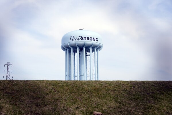 The Flint water tower stands at the City of Flint Water Plant, Monday, March 25, 2024. (AP Photo/Carlos Osorio)
