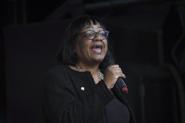 FILE - Then-Shadow Home Secretary Diane Abbott addresses anti-Brexit supporters in London, Oct. 19, 2019. Police say they are investigating whether the largest donor to Britain’s Conservative government committed a crime when he reportedly said a Black member of Parliament made him “want to hate all Black women” and that she “should be shot.” West Yorkshire police said Friday that they are investigating the allegedly racist remarks that businessman Frank Hester made in 2019 about Diane Abbott. (AP Photo/Alberto Pezzali, File)