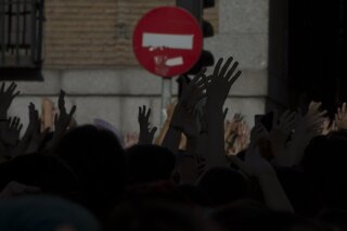 FILE - In this file photo dated Friday, June 22, 2018, protesters demonstrate while blocking the street outside the Justice Ministry in Madrid, Spain.  The first comprehensive internal inquiry on sex abuse allegations by a religious order in Spain has identified 81 children and 37 adult victims by 96 Jesuits since the late 1920s, in a report released Friday Jan. 22, 2021, but associations of victims say it falls short of identifying perpetrators or those who covered up the abuses. (AP Photo/Paul White, FILE)