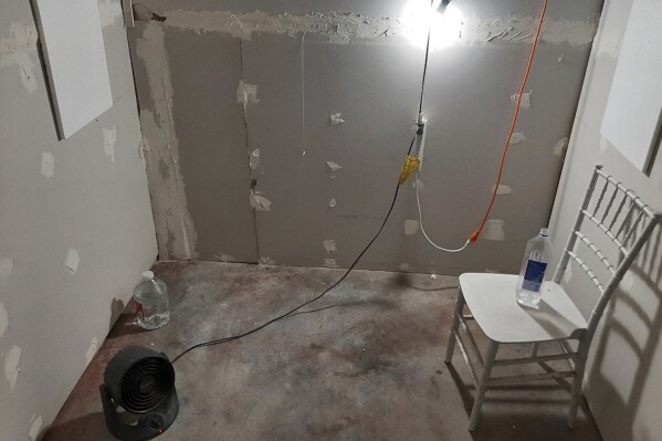 This undated photo provided by the Federal Bureau of Investigation's Portland Field Office shows the interior of a makeshift cinderblock cell in Klamath Falls, Ore., allegedly used by Negasi Zuberi. The FBI said Wednesday, Aug. 2, 2023, that Zuberi, 29, who posed as an undercover police officer kidnapped a woman in Seattle, drove her hundreds of miles to his home in Oregon, and kept her in the cell from which she eventually escaped and found help. Zuberi who was arrested faces a federal interstate kidnapping charge, and authorities said they are looking for additional victims after linking him to sexual assaults in at least four more states. (FBI via AP)