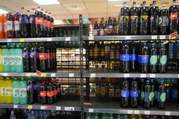 A shelf emptied of CocaCola drinks is seen at a grocery shop in Zagreb, Croatia, Wednesday, Nov. 8, 2023. Authorities in Croatia on Wednesday recommended people drink only tap water as they investigated reports of several cases of people getting sick and suffering injuries allegedly after consuming bottled beverages. They did not say which products were being withdrawn, but photos on social media from shops suggested they were Coca-Cola brands. (AP Photo/Darko Bandic)