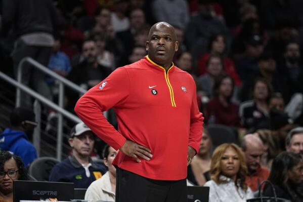 Atlanta Hawks head coach Nate McMillan looks on from the bench during the first half of an NBA basketball game against the Phoenix Suns, Thursday, Feb. 9, 2023, in Atlanta. (AP Photo/John Bazemore)