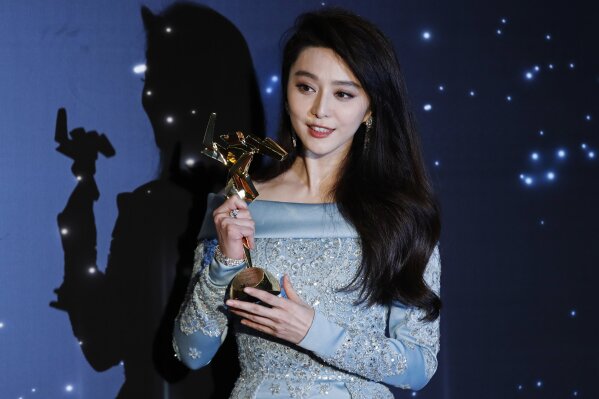 
              FILE - In this March 21, 2017, file photo, Chinese actress Fan Bingbing poses after winning the Best Actress Award of the Asian Film Awards in Hong Kong. Fan Bingbing, one of China's best-known starlets and a rising Hollywood star, has well and truly fallen off the map amid vague allegations of tax shenanigans and possibly other infractions that have put her at odds with China's Communist Party-appointed culture czars. (AP Photo/Kin Cheung, File)
            