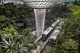 A Skytrain shuttles passengers between terminals through the Jewel complex at Changi Airport, Sunday, July 16, 2023, in Singapore. The nature-themed complex boasts the world's tallest indoor waterfall surrounded by a five story indoor garden with thousands of trees, plants, ferns and shrubs. Singapore has become a global hub for water technology, being home to nearly 200 water companies and over 20 research centers and hosts a biennial International Water Week. (AP Photo/David Goldman)