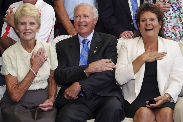 In this photo provided by Tennis Australia, Brian Tobin, centre, sits with Lesley Bowrey, left, and Evonne Goolagong Cawley prior to being presented with official Hall of Fame rings at the Australian Open tennis tournament in Melbourne, Australia, on Jan. 23, 2013. Tobin, the former president of the International Tennis Federation, has died, the sports governing body said on Tuesday, April 23, 2024. The ITF said Tobin died on Monday at the age of 93. (Fiona Hamilton/Tennis Australia/AAP Image via AP)