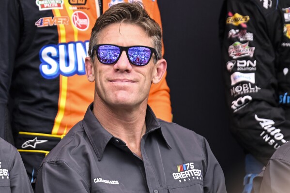 Carl Edwards smiles prior to a NASCAR Cup Series auto race at Darlington Raceway, Sunday, May 14, 2023, in Darlington, S.C. (AP Photo/Matt Kelley, File)