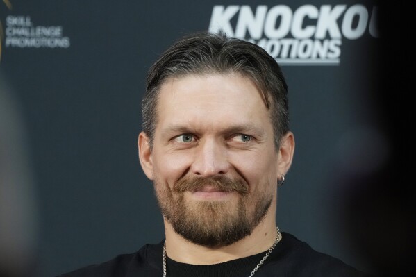 FILE - Ukraine's heavyweight boxing champion and title defender Oleksandr Usyk meets the press in Warsaw, Poland, July 10, 2023, ahead of his fight against Britain's Daniel Dubois on Aug. 26 at Tarczynski Arena in Wroclaw. Oleksandr Usyk will defend his heavyweight boxing titles for the first time in a year when he faces hard-hitting British challenger Daniel Dubois in a clash of styles. (AP Photo/Czarek Sokolowski, File)