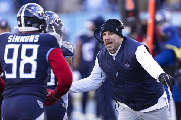 Tennessee Titans head coach Mike Vrabel, right, congratulates players as the leave the field after a touchdown during an NFL football game against the Houston Texans, Saturday, Dec. 24, 2022, in Nashville, Tenn. (AP Photo/Wade Payne)