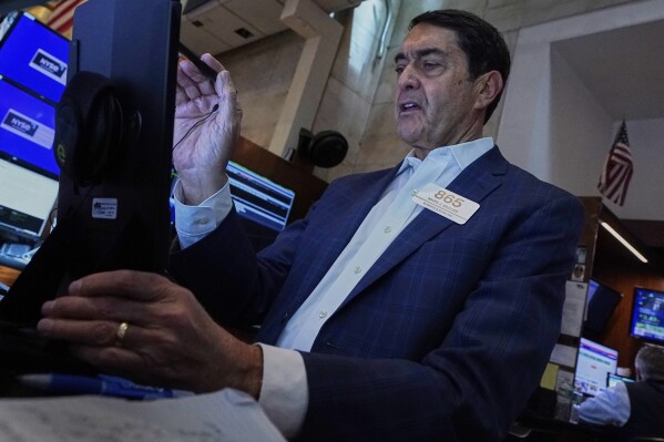 Trader Mark Muller works on the floor of the New York Stock Exchange, Monday, May 12, 2025. (AP Photo/Richard Drew)