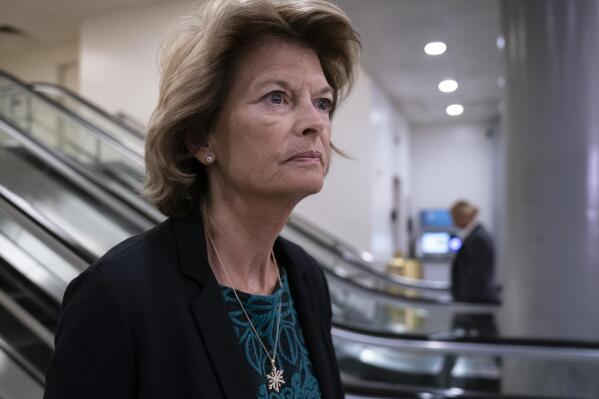 FILE - In this Jan. 8, 2020, file photo Sen. Lisa Murkowski, R-Alaska, heads to a briefing on Capitol Hill in Washington. An Alaska man faces federal charges after authorities allege he threatened to hire an assassin to kill Murkowski, according to court documents unsealed Wed., Oct. 6, 2021. (AP Photo/J. Scott Applewhite,File)
