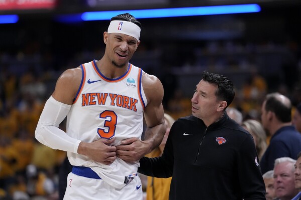 New York Knicks guard Josh Hart (3) reacts after getting injured during the first half of Game 6 against the Indiana Pacers in an NBA basketball second-round playoff series, Friday, May 17, 2024, in Indianapolis. (Ǻ Photo/Michael Conroy)