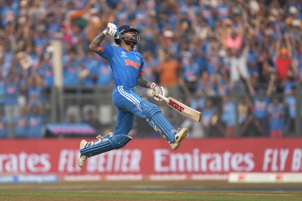 India's Virat Kohli celebrates his century during the ICC Men's Cricket World Cup first semifinal match between India and New Zealand in Mumbai, India, Wednesday, Nov. 15, 2023. Kohli hit his record 50th century in one-day internationals at the Cricket World Cup on Wednesday, surpassing the mark he shared with countryman Sachin Tendulkar. (AP Photo/Rafiq Maqbool)