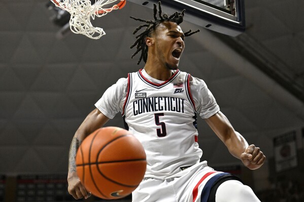 UConn guard Stephon Castle (5) reacts after dunking the ball in the first half of an NCAA college basketball game against Seton Hall, Sunday, March 3, 2024, in Storrs, Conn. (AP Photo/Jessica Hill)