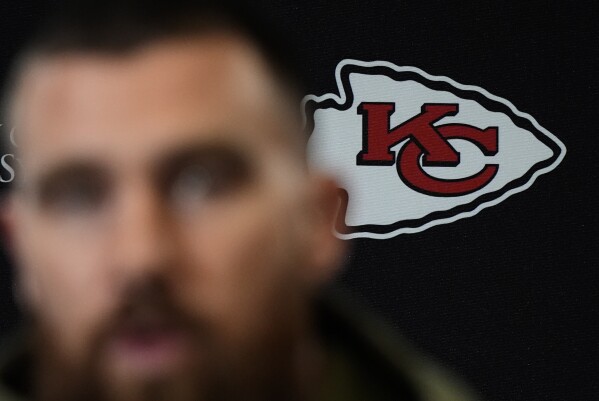 Kansas City Chiefs tight end Travis Kelce talks to the media before the team's NFL football practice Friday, Feb. 2, 2024 in Kansas City, Mo. The Chiefs will play the San Francisco 49ers in Super Bowl 58. (AP Photo/Charlie Riedel)