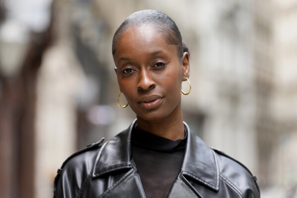 Fashion model Alexsandrah poses for a photograph, in London, Friday, March 29, 2024. The use of computer-generated supermodels has complicated implications for diversity. Although AI modeling agencies -- some of them Black-owned -- can render models of all races, genders and sizes at the click of a finger, real models of color who have historically faced higher barriers to entry may be put out of work. (AP Photo/Kirsty Wigglesworth)